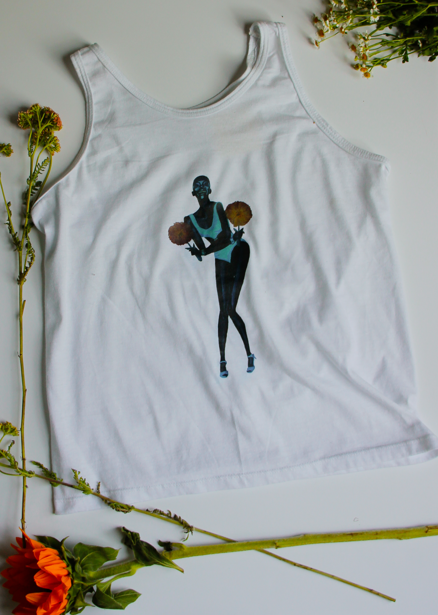A white upcycled tank top with an illustration of model Adut Akech on it