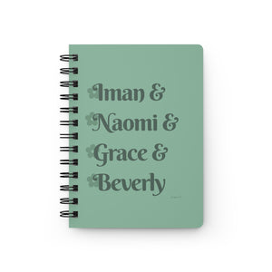 A light green notebook with dark green text that reads "Iman & Naomi & Grace & Beverly" in reference to the Black models Iman Abdulmajid, Naomi Campbell, Grace Jones, and Beverly Johnson