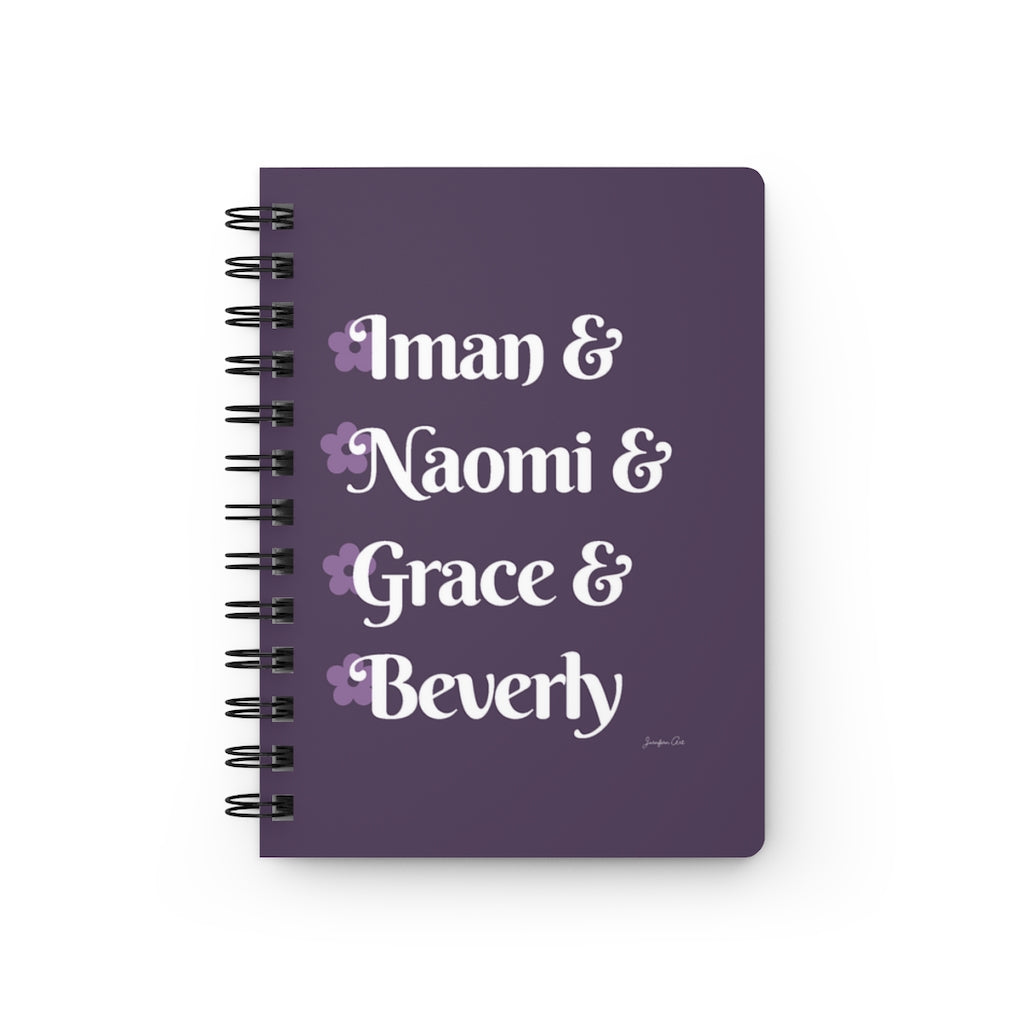 A light purple notebook with white text that reads "Iman & Naomi & Grace & Beverly" in reference to the Black models Iman Abdulmajid, Naomi Campbell, Grace Jones, and Beverly Johnson