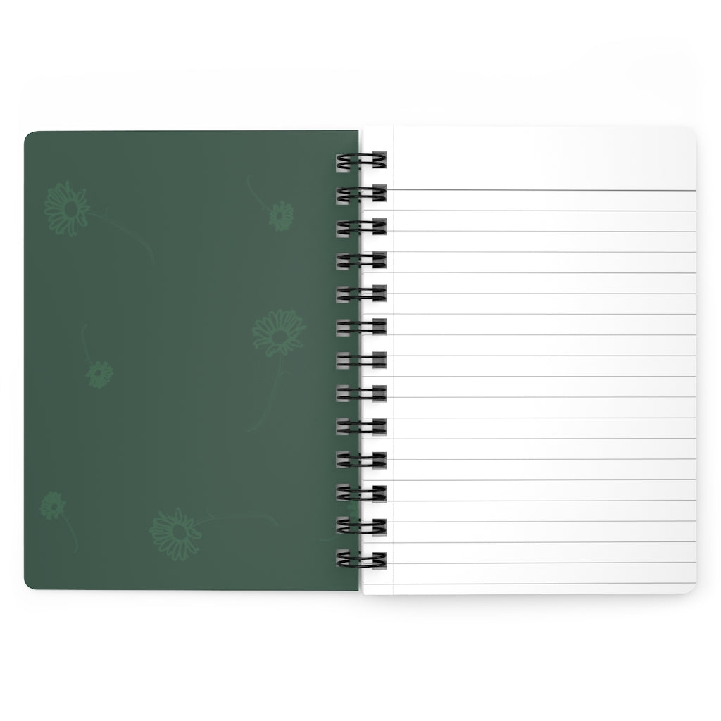 The inside cover of a lined journal that is green with simple light green flowers