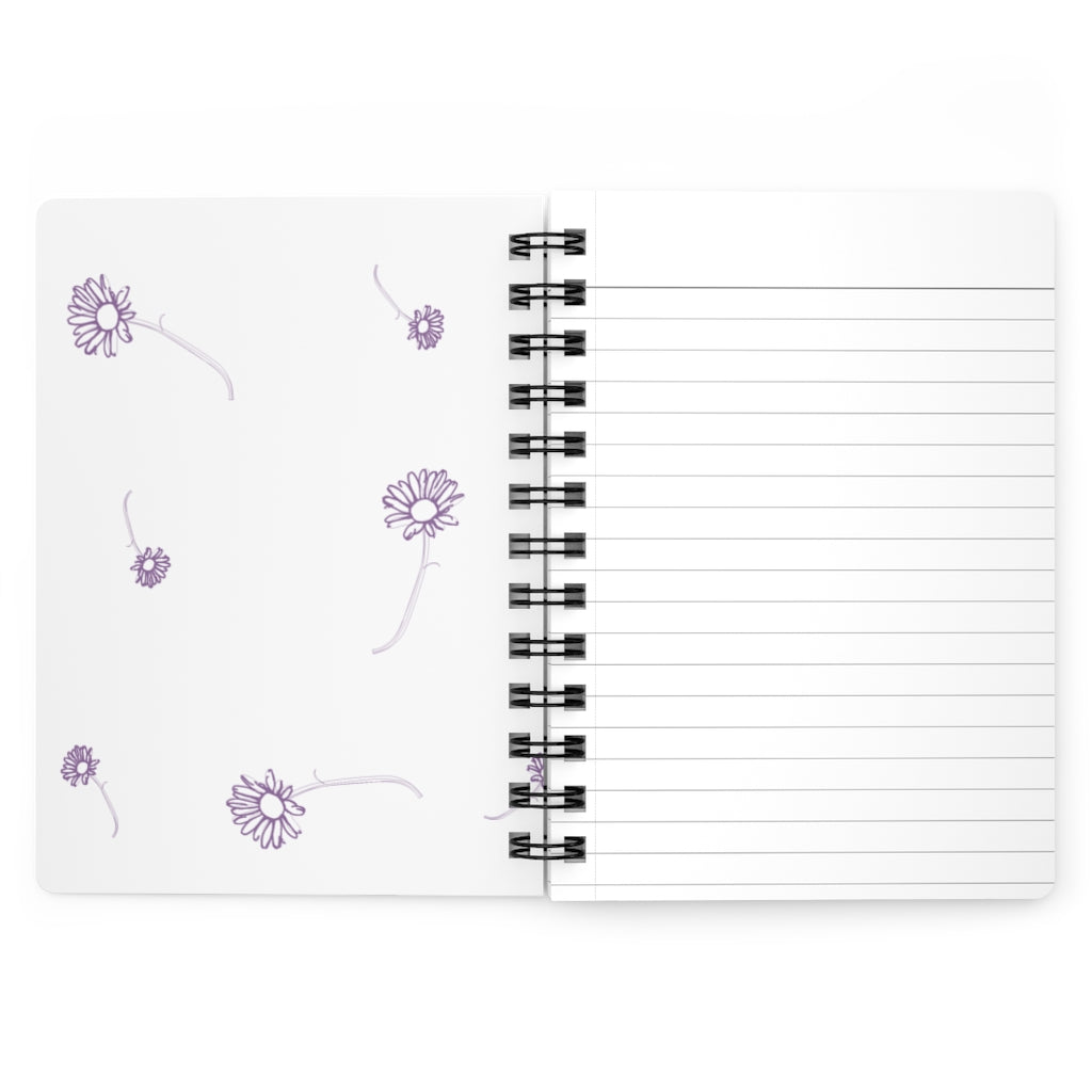 The inside cover of a lined journal that is white with simple purple flowers