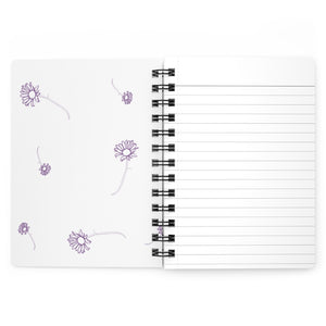 The inside cover of a lined journal that is white with simple purple flowers