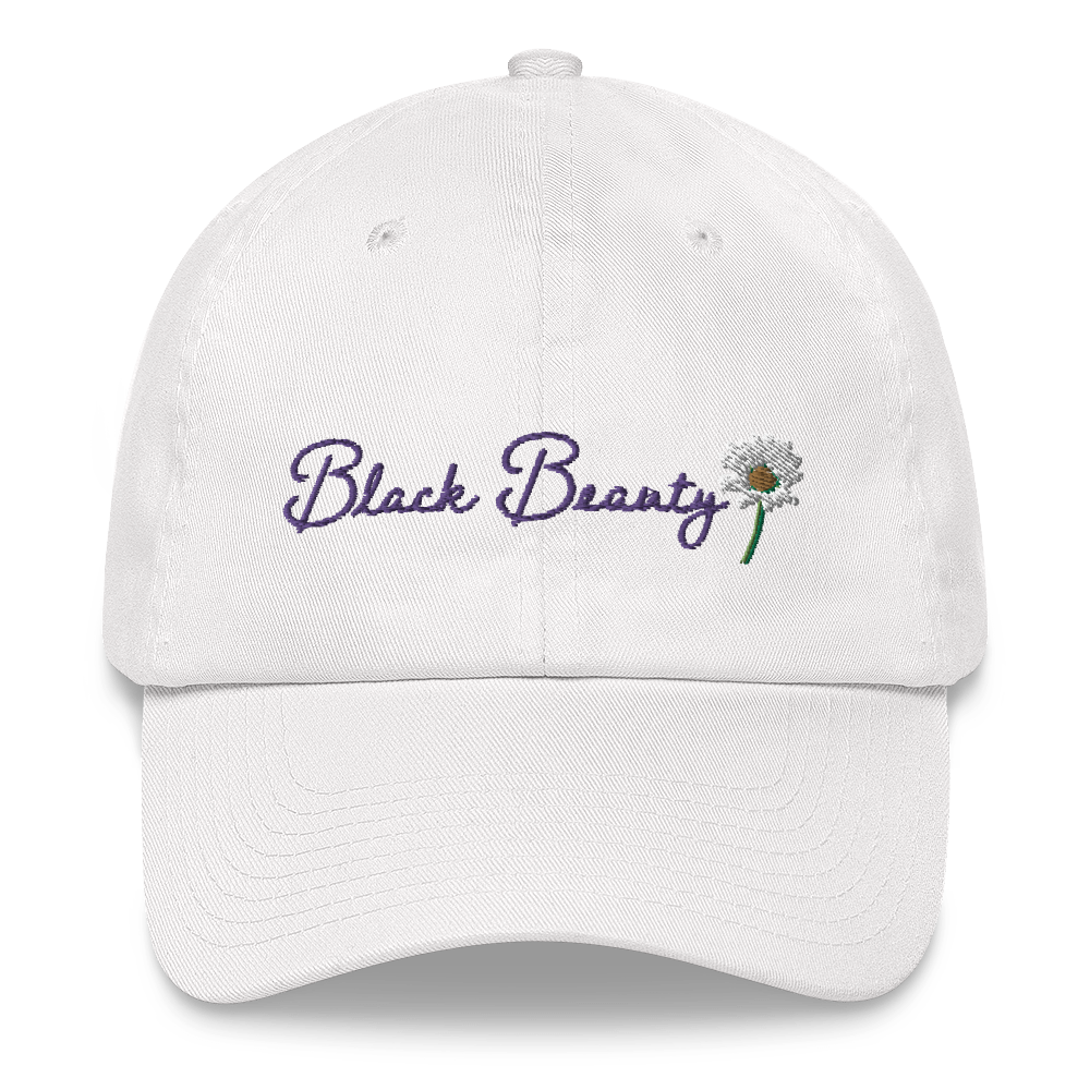 A white baseball cap with purple cursive embroidered text that reads "Black Beauty" with an embroidered daisy