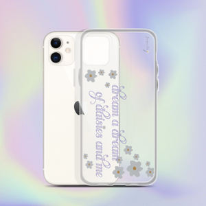 A transparent iPhone 11 case with cursive purple text on it that reads "dream a dream of daisies and me" surrounded by small daisies