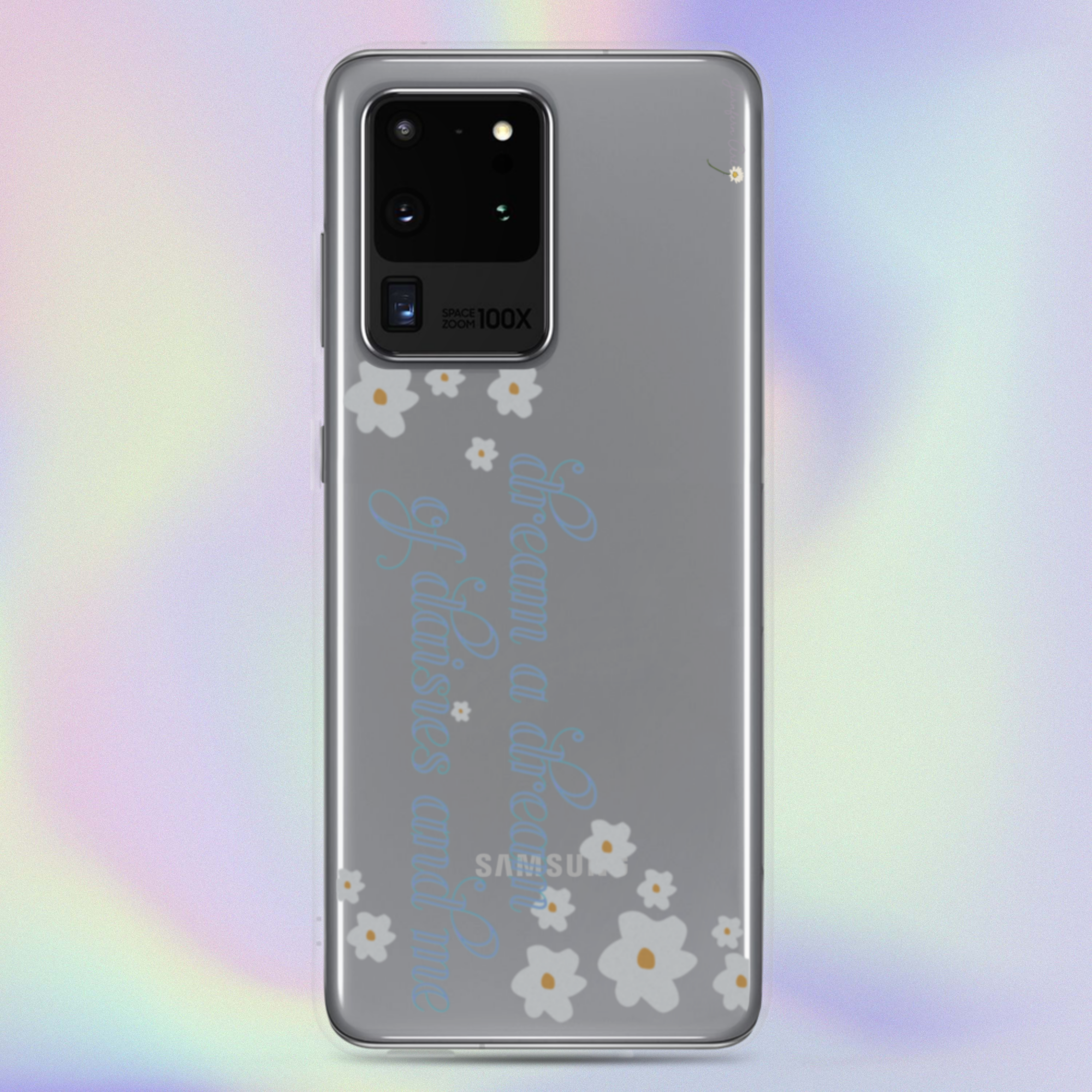 A transparent Samsung Galaxy S20 Ultra phone case with cursive blue text on it that reads "dream a dream of daisies and me" surrounded by small daisies