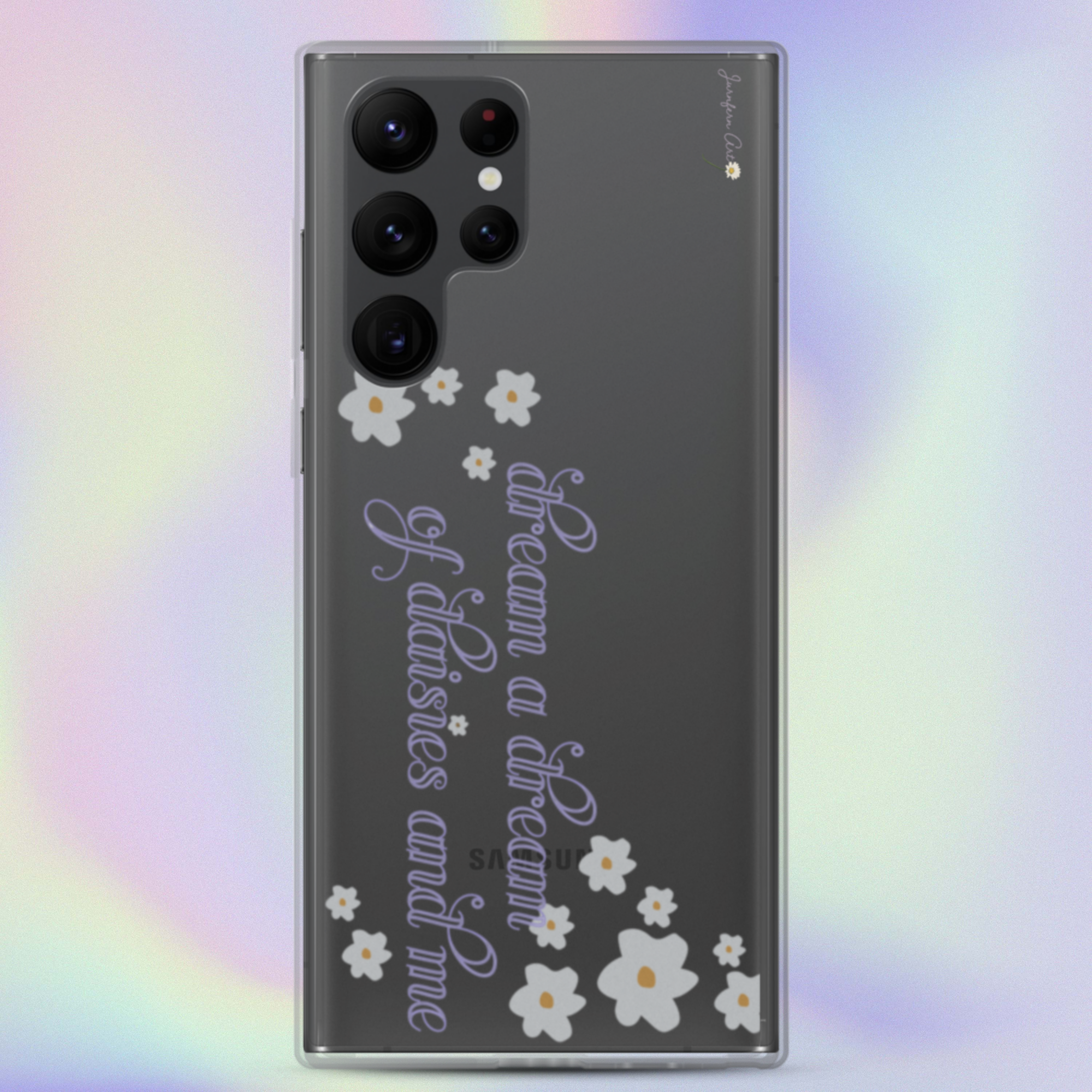 A transparent Samsung Galaxy S22 Ultra phone case with cursive lavender text on it that reads "dream a dream of daisies and me" surrounded by small daisies