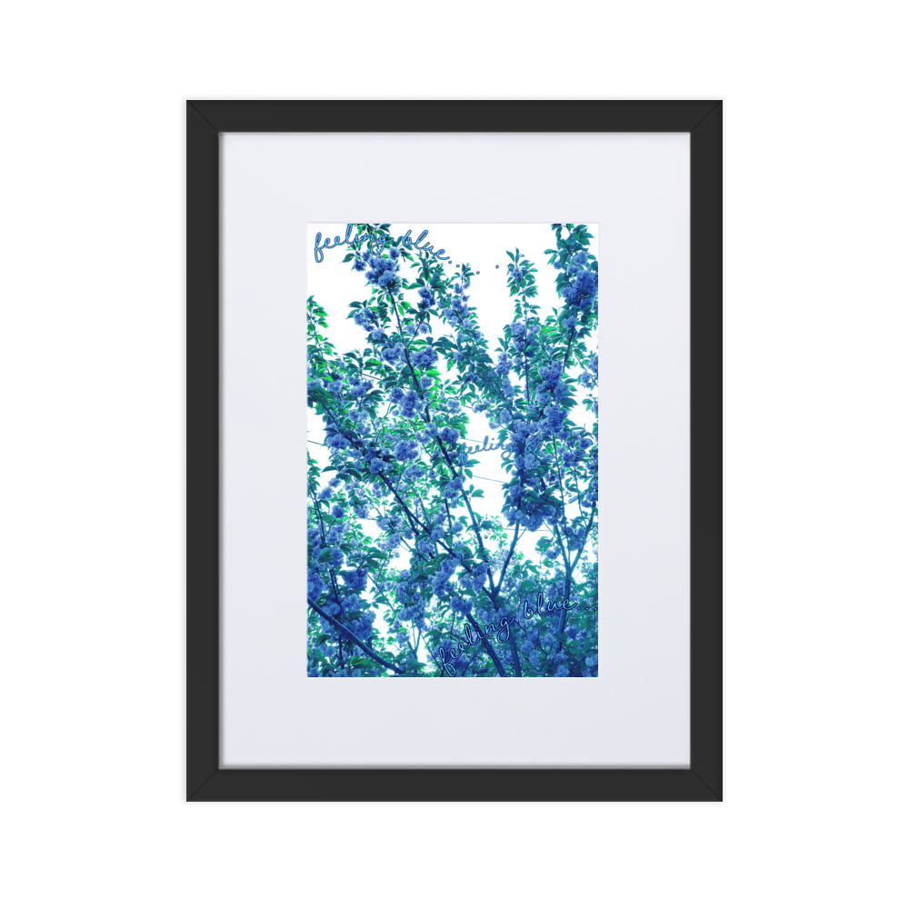 A black framed print with a white mat boarder and an abstract blue floral print