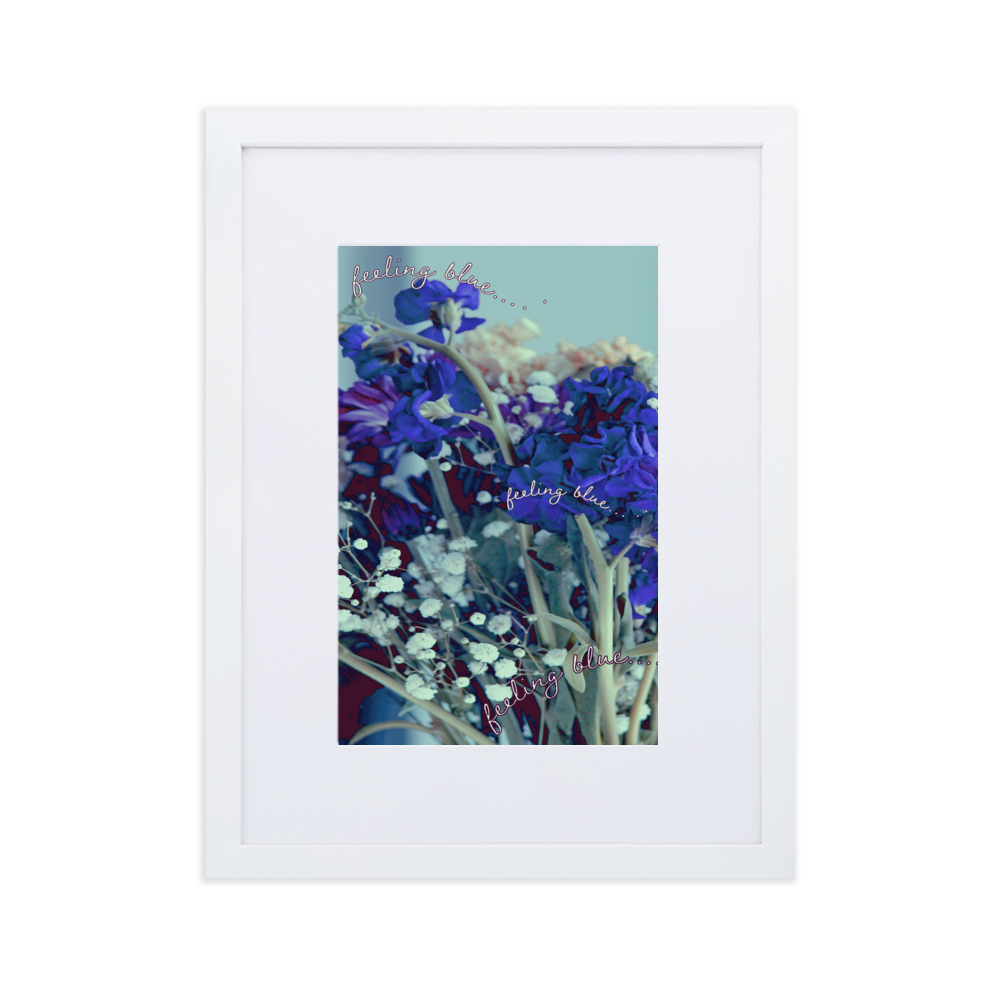 A close-up blue and purple flower photo inside of a white frame with a white mat boarder
