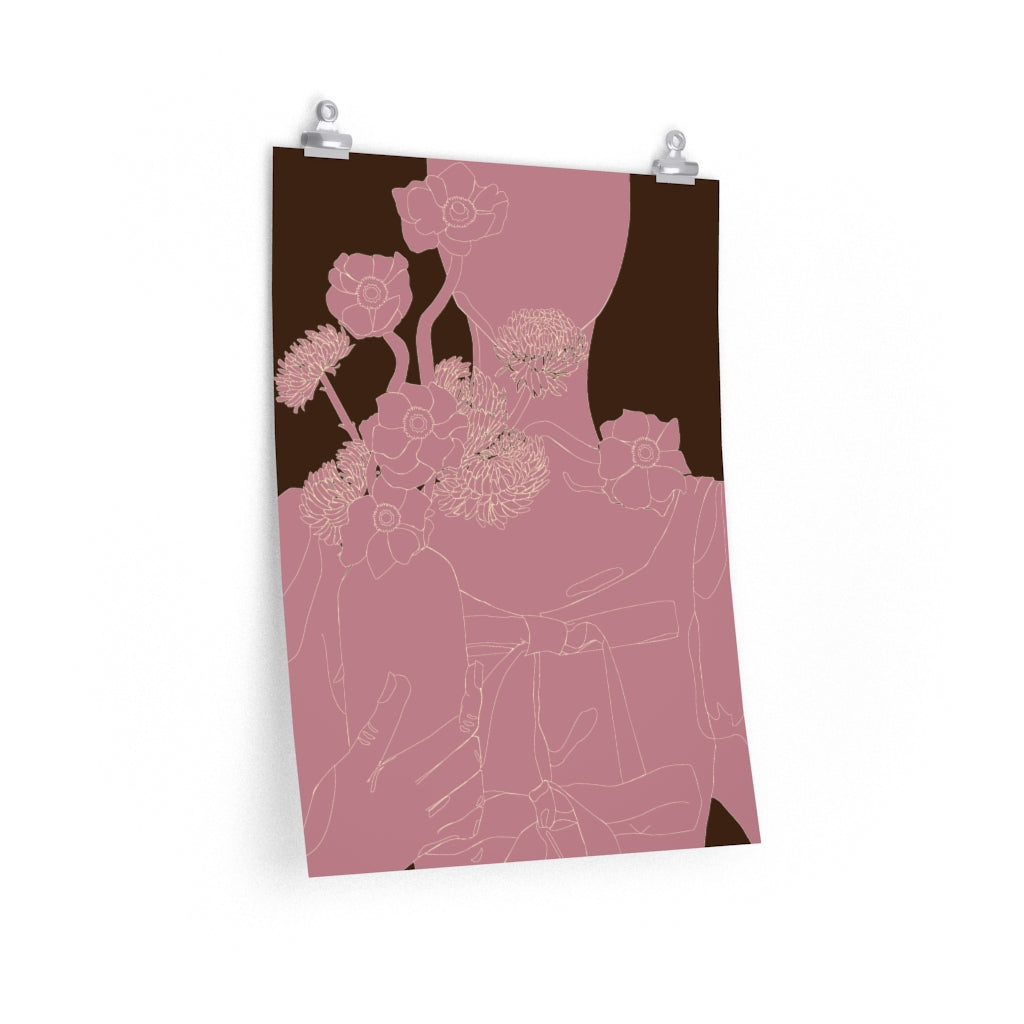 A 18 by 24 inch poster with a minimalist, monochrome pink graphic illustration of a woman holding a vase of flowers