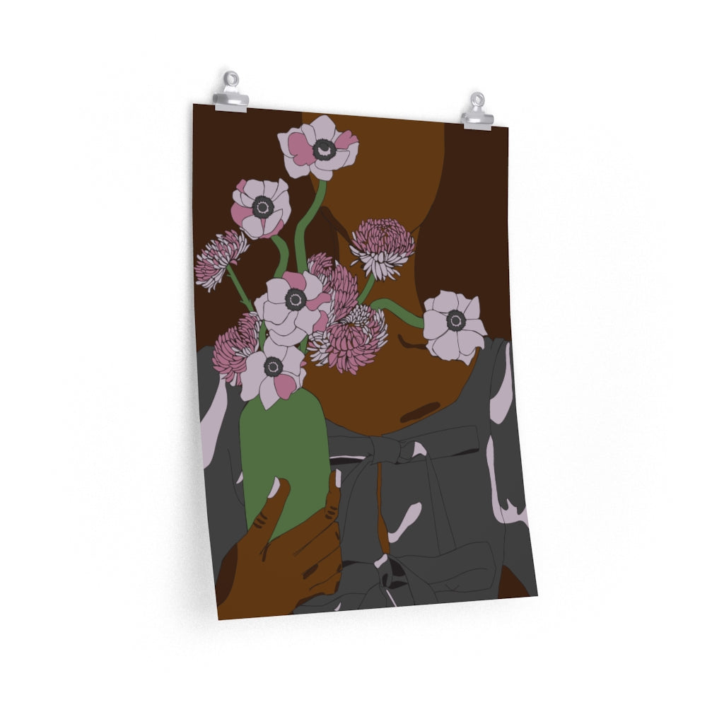 A 18 by 24 inch poster with a minimalist graphic illustration of a black woman holding a vase of pink flowers
