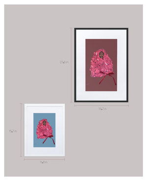 A chart showing the two size options available for a framed print with matting featuring an illustration of Black supermodel Adut Akech wearing a pink Valentino gown with a bow on it