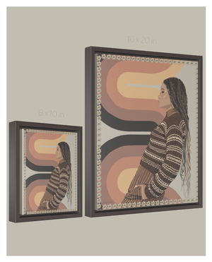 A chart showing two size options of a framed canvas illustration of Storm Reid standing in front of a 70's print wallpaper and wearing a striped brown sweater with brown men's trousers