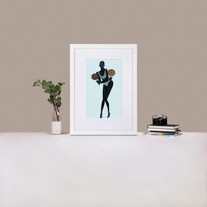 Blue painting of Black model Adut Akech with a light blue background in a white frame with matting, standing on a desk with a plant and books
