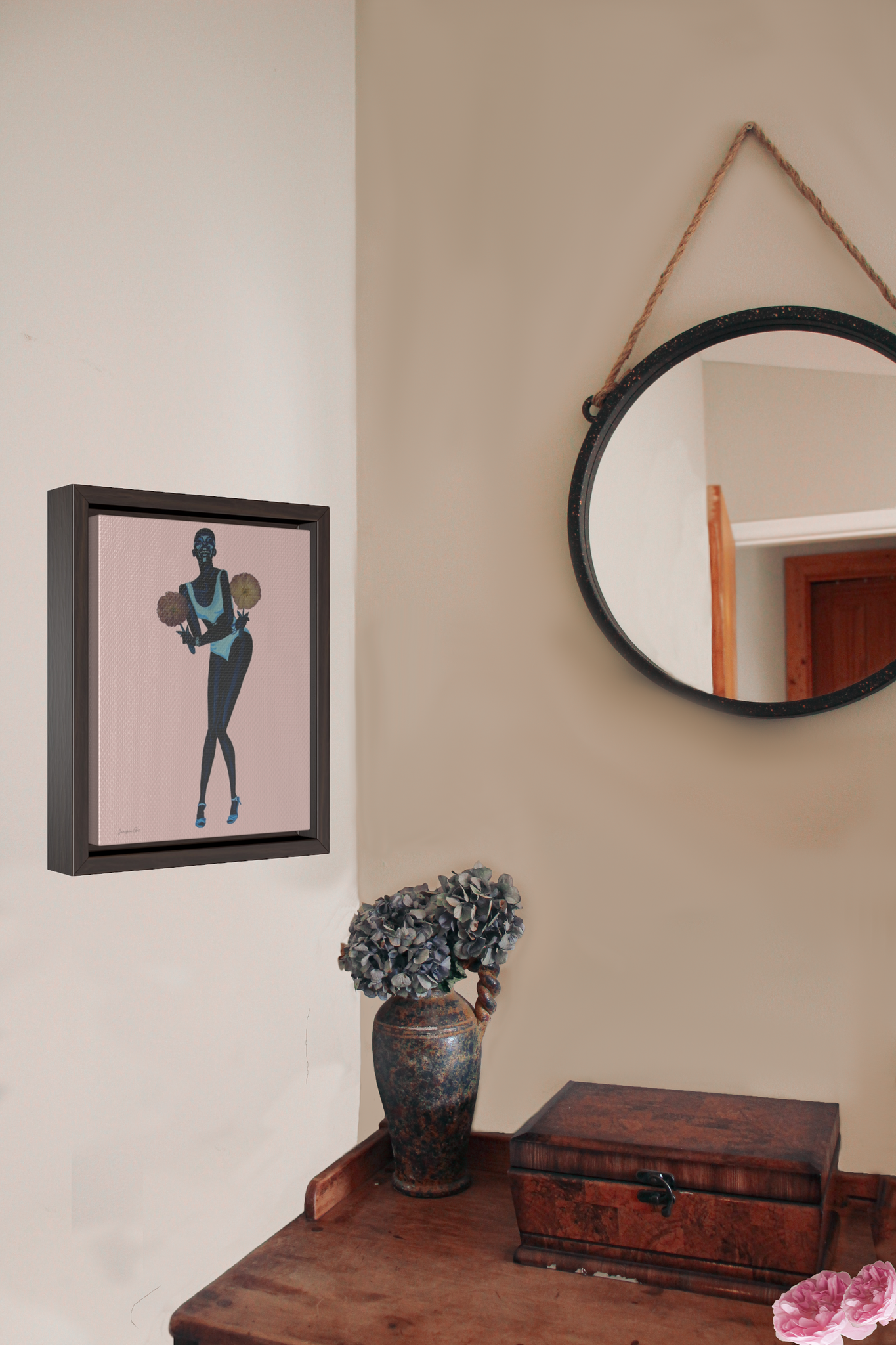 Framed wall art canvas in Light Pink by Jurnfern Art, of model Adut Akech, hanging on bedroom wall