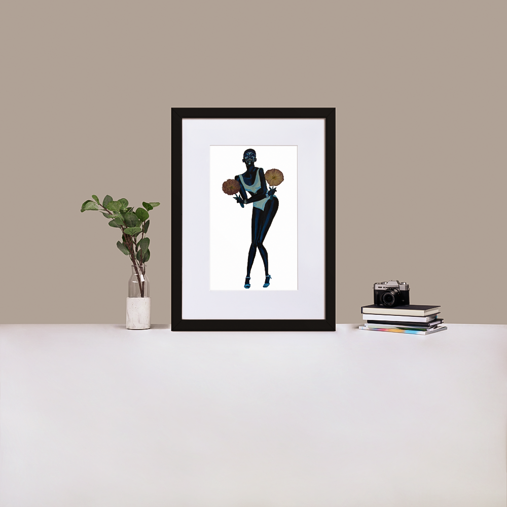 Monochrome blue painting of Black supermodel Adut Akech holding pressed flowers with a plain background in a black frame with matting, standing on a desk with a plant and books