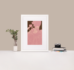 A minimalist monochrome pink line drawing of a woman holding a vase of flowers, framed in a white frame with a white mat boarder that is standing up on a white desk next to a stack of books and a plant