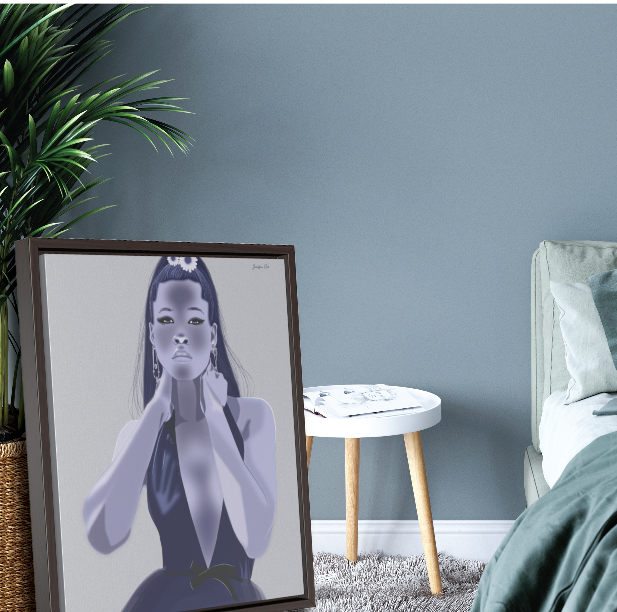 A large framed canvas with a gray background and an illustration of actress Storm Reid modeling a blue deep V-neck gown. The framed canvas is leaning against a potted plant next to a bed