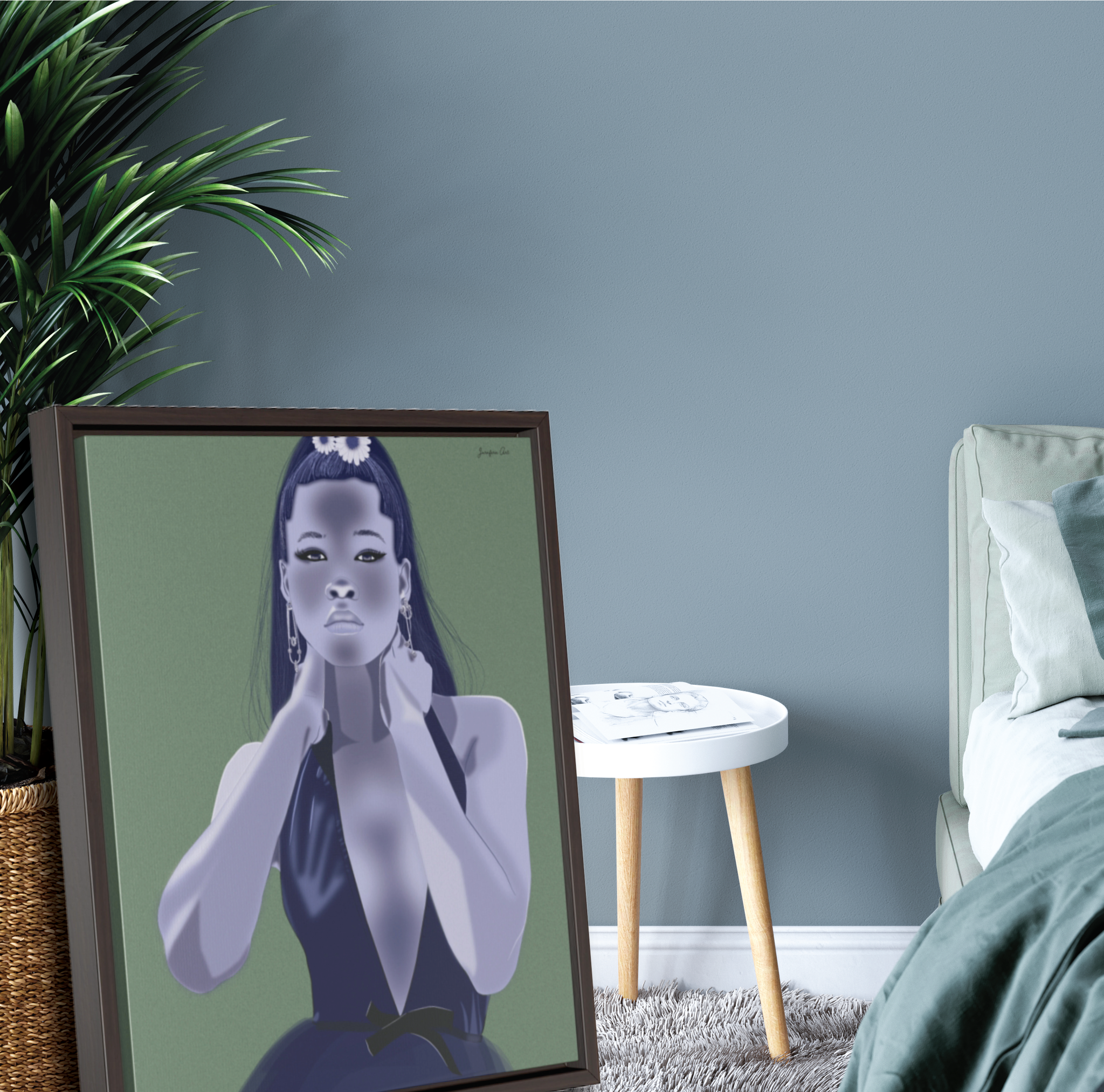 A large framed canvas with a green background and an illustration of actress Storm Reid modeling a blue deep V-neck gown. The framed canvas is leaning against a potted plant next to a bed