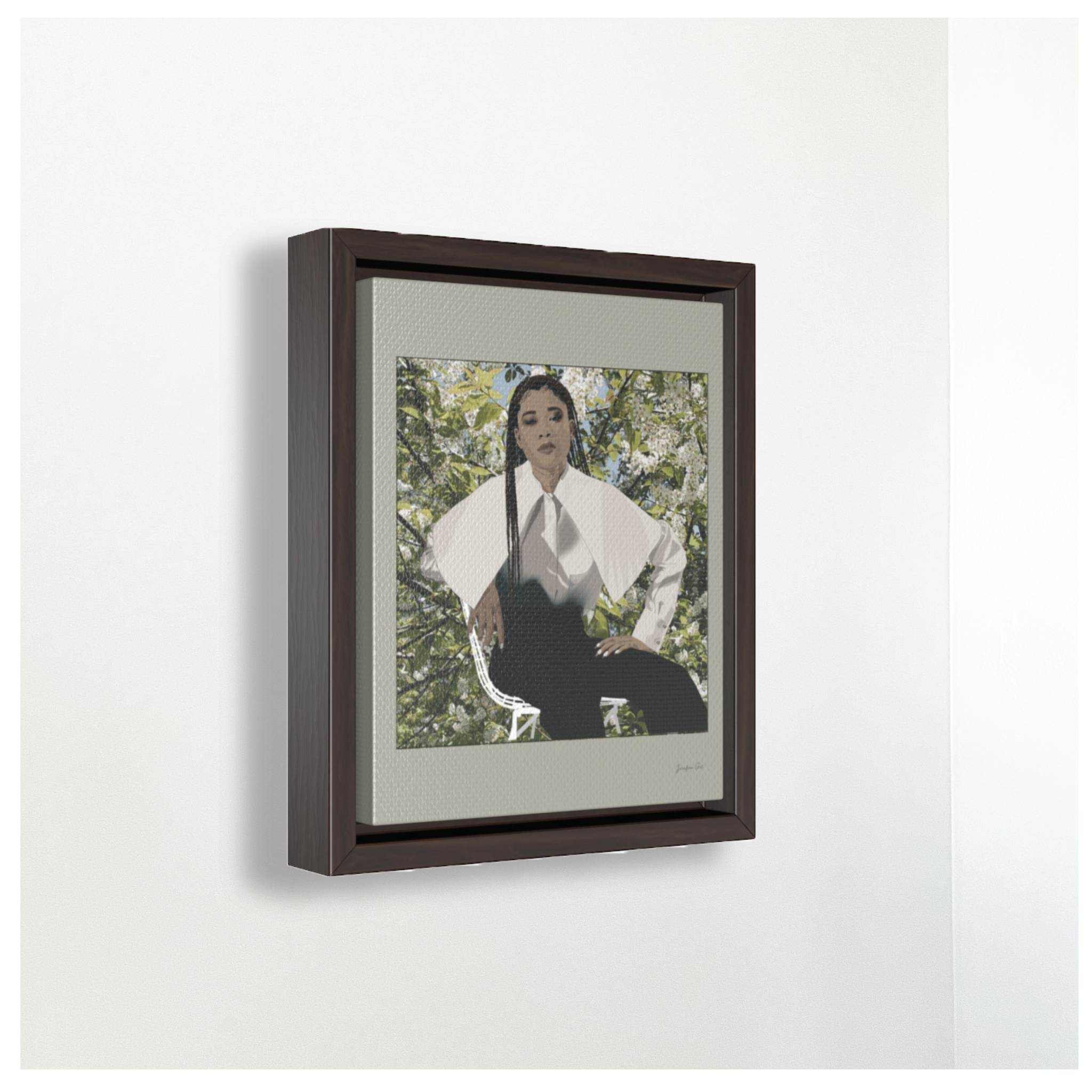A small framed canvas illustration with a beige background and a digital illustration of actress Storm Reid posing in a chair and wearing a white blouse and black trousers, with a photo of flowers and leaves behind her