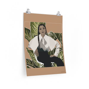 A 18 by 24 inch poster with an orange background and a digital illustration of Storm Reid posing in chair and wearing a white blouse with black trousers, with a cut-out photo of leaves behind her