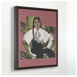 A large framed canvas illustration with a pink background and a digital illustration of actress Storm Reid posing in a chair and wearing a white blouse and black trousers, with a cut-out photo of leaves behind her