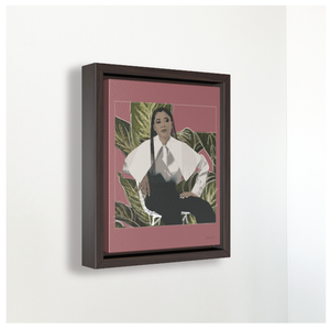 A small framed canvas illustration with a pink background and a digital illustration of actress Storm Reid posing in a chair and wearing a white blouse and black trousers, with a cut-out photo of leaves behind her