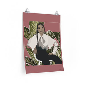 A 18 by 24 inch poster with a pink background and a digital illustration of Storm Reid posing in chair and wearing a white blouse with black trousers, with a cut-out photo of leaves behind her